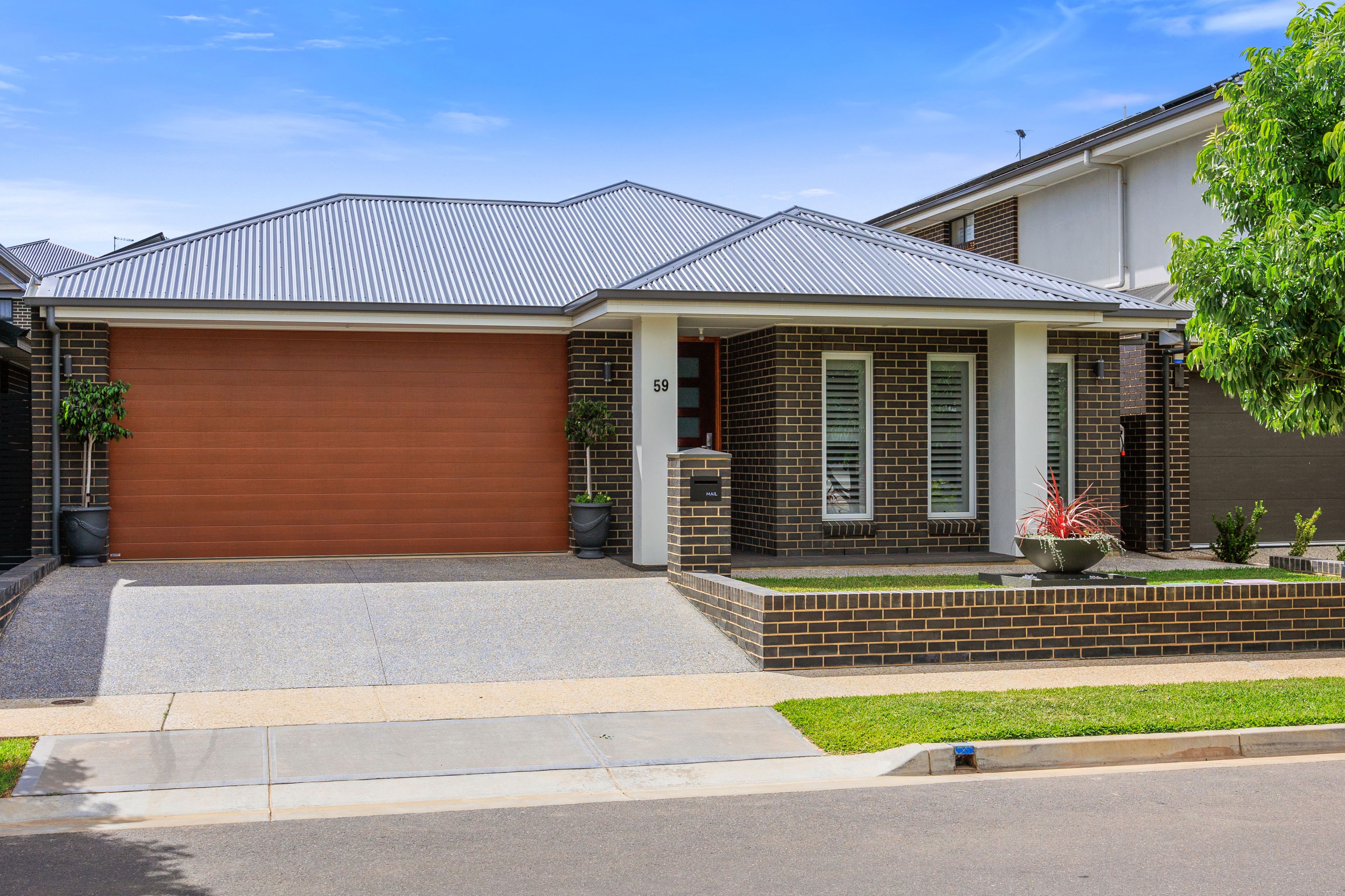 Stylish Multi-Living Family Home Is An Understated Suburban Stunner